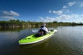 Active senior kayaking on Nine Mile Pond in Everglades National Park, Florida.,