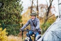 Active senior man with electrobike cycling outdoors in park. Royalty Free Stock Photo