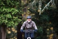 Active senior man with electrobike cycling outdoors on a road in nature. Royalty Free Stock Photo