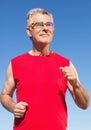 Active senior man jogging on the pier Royalty Free Stock Photo