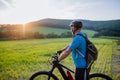 Active senior man riding bicycle at summer park, healthy lifestyle concept. Royalty Free Stock Photo