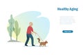 Active senior man walking with dog at park outdoor. Healthy aging, elderly care and wellness concept