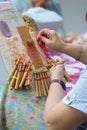 Active senior people workshop with traditional bobbin lace crochet. Hands detail and empty copy space Royalty Free Stock Photo