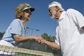 Active Senior Tennis Players Shaking Hands Royalty Free Stock Photo