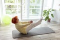 Active senior woman holding boat yoga pose Royalty Free Stock Photo