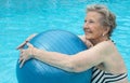 Active senior woman in the pool, doing exercises Royalty Free Stock Photo