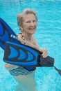 Active senior woman in the pool, doing exercises Royalty Free Stock Photo