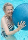 Active senior woman in the pool, doing exercises Royalty Free Stock Photo