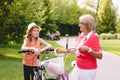 Active senior woman riding bike in a park Royalty Free Stock Photo