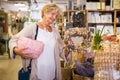 Active senior woman shopping at household store Royalty Free Stock Photo