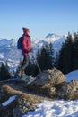 Active senior woman snowshoeing in in the Allgau alps above Immenstadt