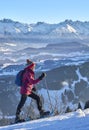 Active senior woman snowshoeing in in the Allgau alps above Immenstadt