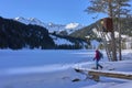 Active senior woman snowshoeing in Vorarlberg, Austria