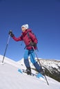 Active senior woman snowshoeing in Vorarlberg, Austria