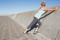 Active senior woman stretching on the pier Royalty Free Stock Photo