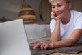 Active senior woman surfing in internet on yoga mat Royalty Free Stock Photo