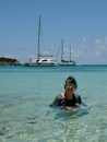 Active Senior Woman Swimming in Tropical Bay