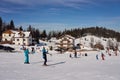 Active skiers on slope in european Bialy Krzyz in Poland