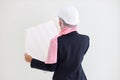 Active and smart muslim engineer young asian woman in blue suit smiling confident holding blueprint in studio.