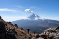 Active snowcapped Popocatepetl volcano with visible smoke, Mexico