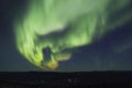 Active splitting aurora borealis arc