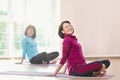 Active sportive mature women doing exercise in a gym