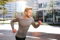 Active sports man running outside in the city Royalty Free Stock Photo