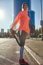 Active sporty girl do stretching working out in street