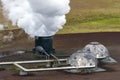 Active steam stack and parts of Krafla geothermal power plant in Nordurland eystra region of Northern Iceland Royalty Free Stock Photo