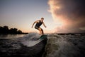 Active strong young man riding down the river waves in beautiful Royalty Free Stock Photo