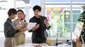 Teamwork of young asian designer working and brainstorming together with discussion on project business task. Royalty Free Stock Photo