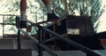 Active teen skater jumping on rail with skate board at urban skate park. Royalty Free Stock Photo