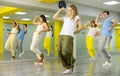 Teenage girl training breakdance Toprock moves in dance hall