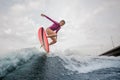 Active teenager girl jumping on the wakeboard Royalty Free Stock Photo