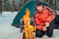 Active tourist near the campfire in the tent camp