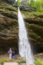 Active tourists looking at Pericnik waterfall in Vrata Valley in Triglav National Park in Julian Alps, Slovenia.