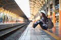 Active and travel lifestyle concept, Woman traveler tourist walking with luggage at train station Royalty Free Stock Photo