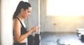 Active woman athlete taking rest and use smartphone after exercising at gym. Fitness Healthy lifestye and workout at gym concept Royalty Free Stock Photo