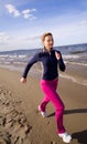 Active woman on the beach Royalty Free Stock Photo