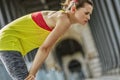 Active woman catching breath after exercise on bridge in Paris Royalty Free Stock Photo