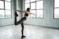 Active woman doing balance movement for stretch her legs Royalty Free Stock Photo