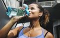 Active woman drinking water after exercise Royalty Free Stock Photo