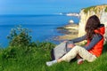 Active woman hiking and looking at beautiful ocean view Royalty Free Stock Photo