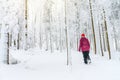 Active woman hiking in white winter snowy forest Royalty Free Stock Photo