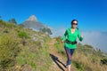 Active woman runner runs trail