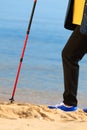 Active woman senior nordic walking on a beach. legs Royalty Free Stock Photo