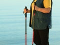 Active woman senior nordic walking on a beach Royalty Free Stock Photo