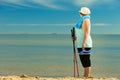 Active woman senior nordic walking on a beach Royalty Free Stock Photo