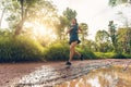 Active woman trail runner running in the forest in the morning Royalty Free Stock Photo