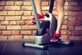 Active woman using exercise bike at the gym. Royalty Free Stock Photo